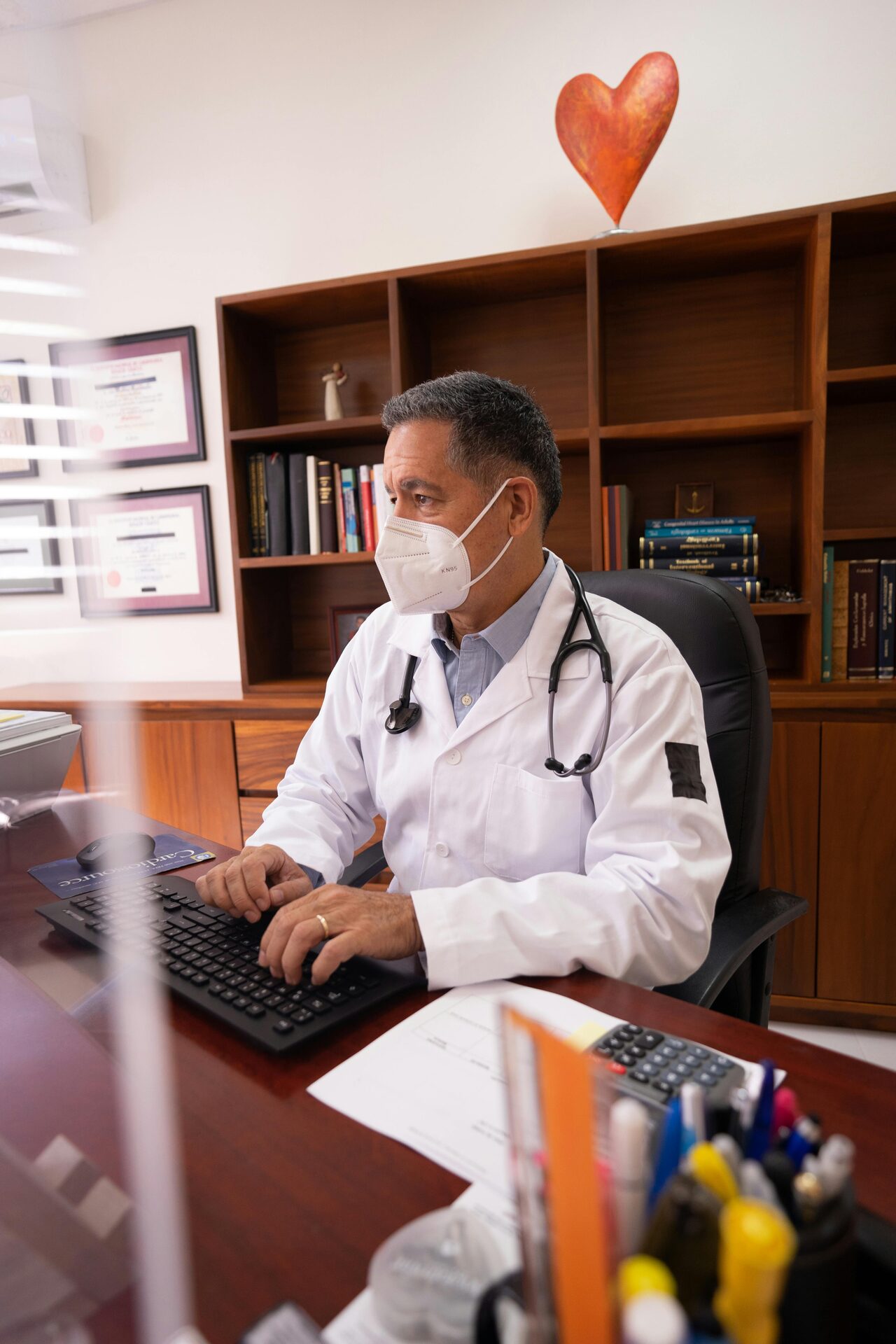 Doctor speaking to students through a virtual call on a computer
