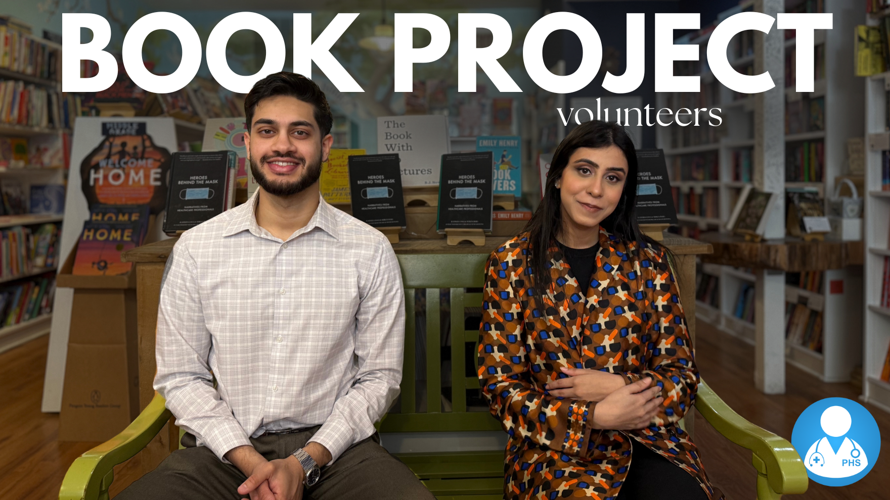 Volunteers discussing the Heroes Behind the Mask book project on camera