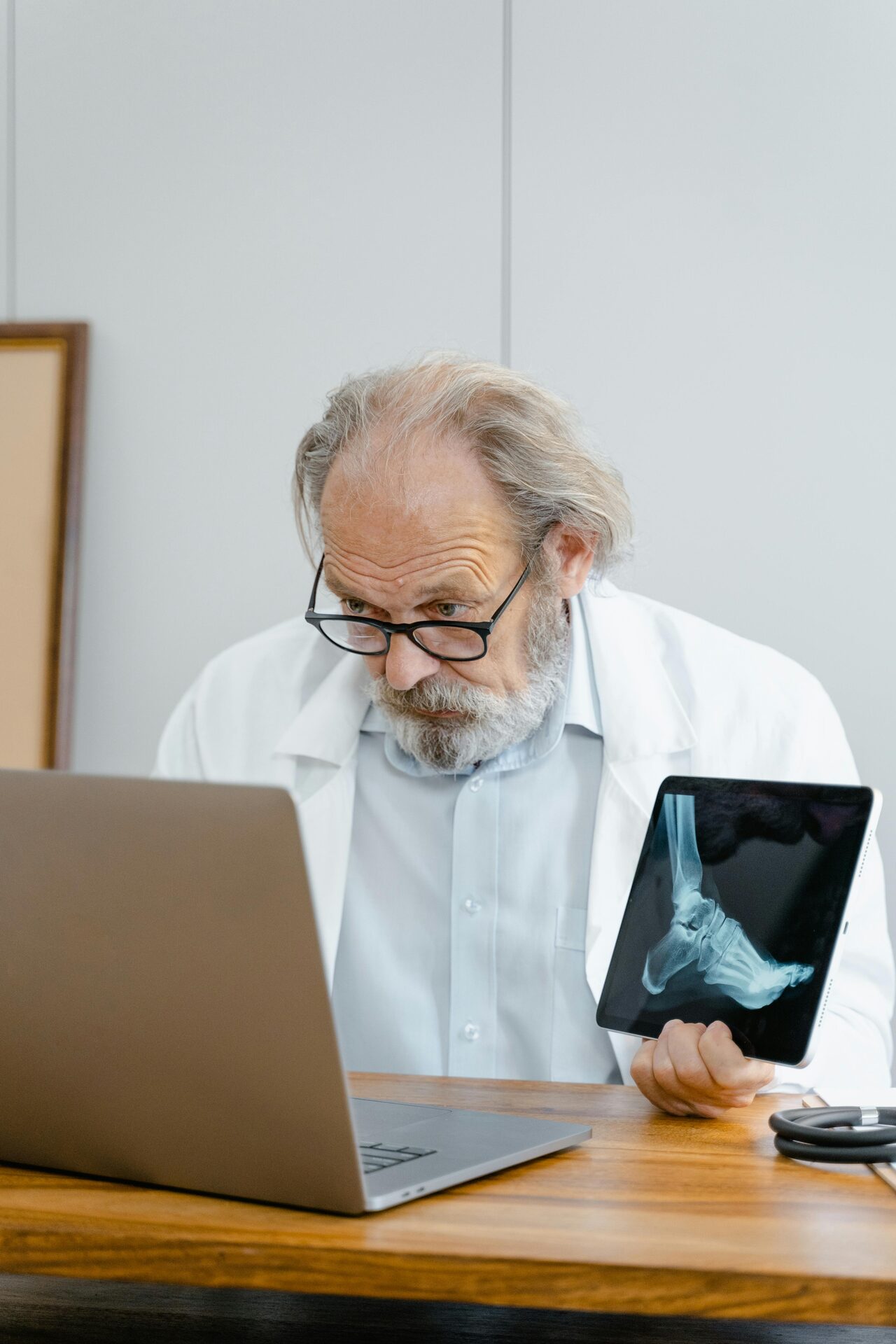 Physician at a desk engaging with a virtual learning setup